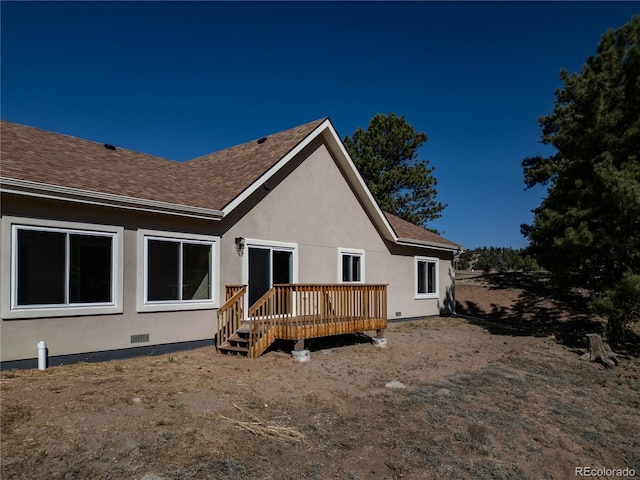 rear view of house with a deck