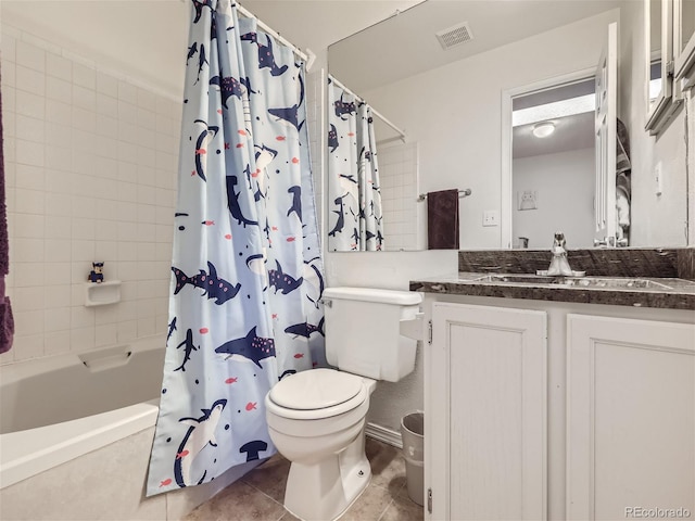 full bathroom featuring vanity, tile patterned floors, toilet, and shower / bath combo with shower curtain