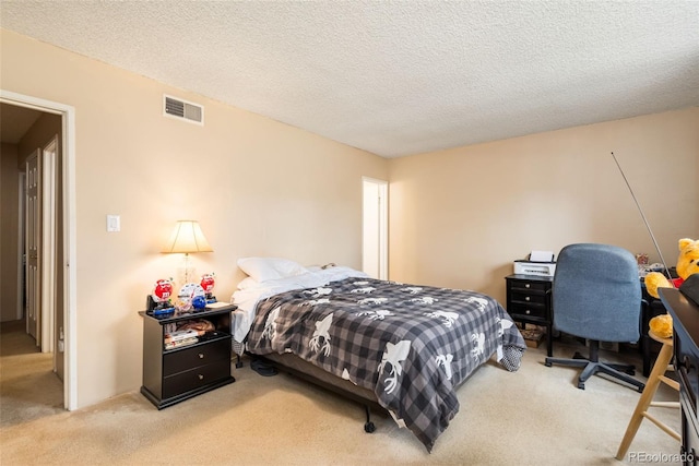bedroom with carpet, a textured ceiling, and visible vents