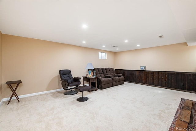 carpeted living room with baseboards, recessed lighting, and visible vents
