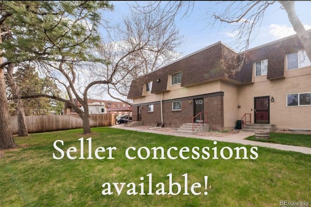 7755 E Quincy Ave Unit T80, Denver, CO 80237 - rear view of property with mansard roof, roof with shingles, and stucco siding