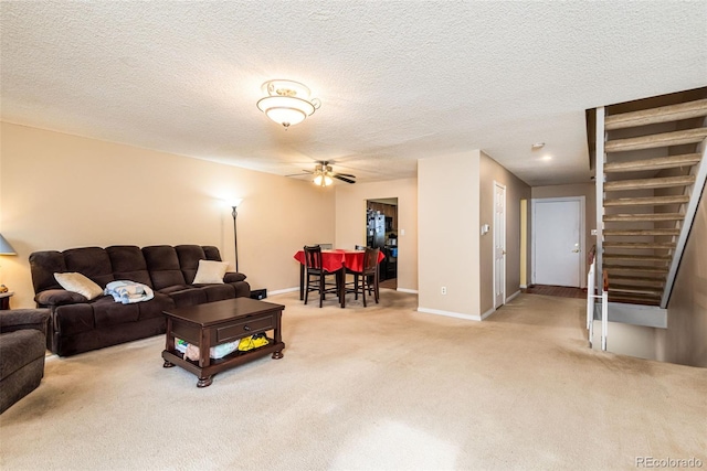 7755 E Quincy Ave Unit T80, Denver, CO 80237 - living room featuring carpet, a ceiling fan, baseboards, a textured ceiling, and stairway