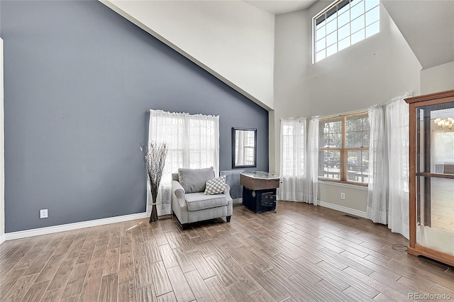 3163 E 133rd Ave, Thornton, CO 80241 - living area featuring wood finish floors and a towering ceiling