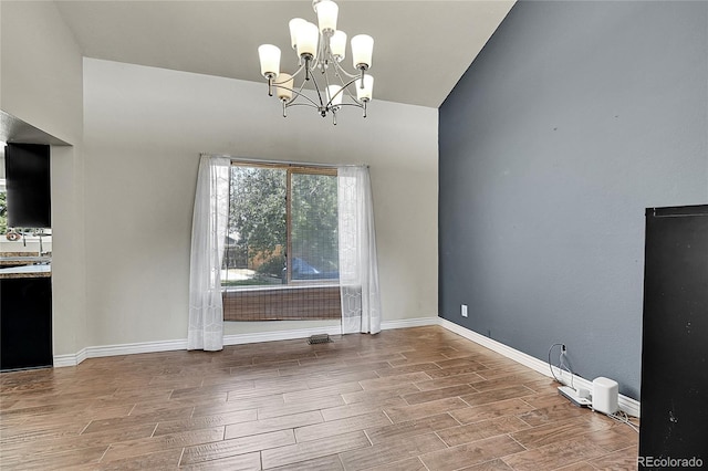 3163 E 133rd Ave, Thornton, CO 80241 - unfurnished dining area with a chandelier and wood finished floors