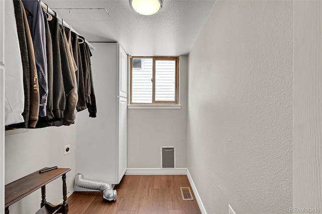 3163 E 133rd Ave, Thornton, CO 80241 - walk in closet featuring wood finished floors