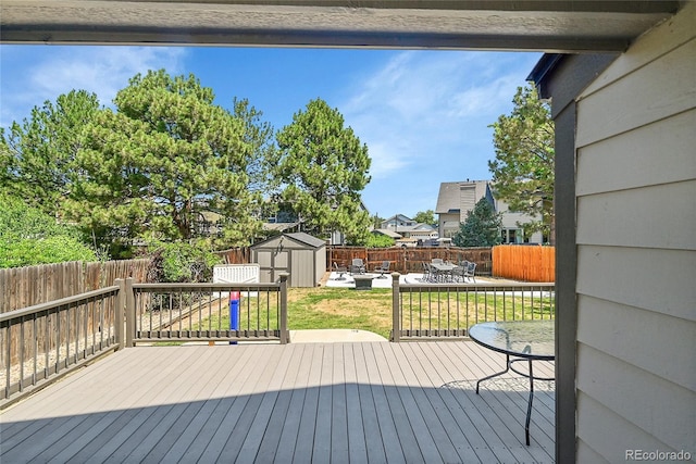 3163 E 133rd Ave, Thornton, CO 80241 - wooden deck featuring a shed, a fenced backyard, a patio area, and a residential view