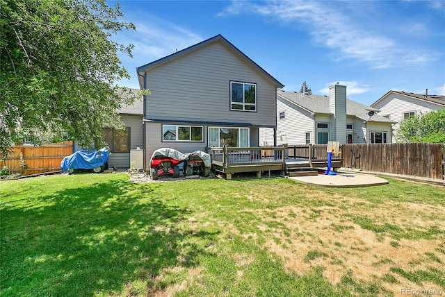 3163 E 133rd Ave, Thornton, CO 80241 - rear view of house with a fenced backyard and a deck