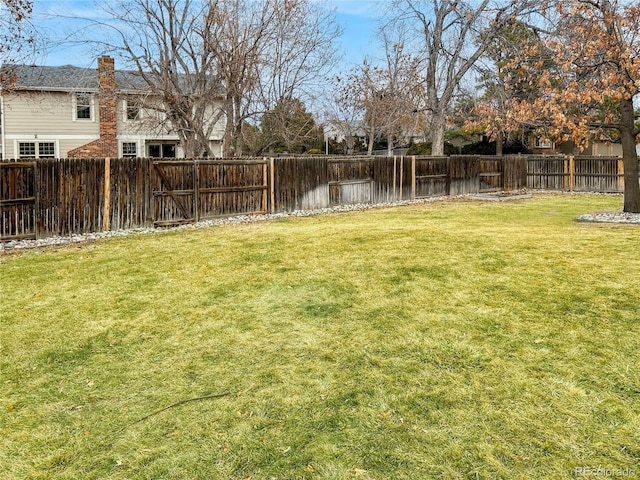 view of yard featuring a fenced backyard