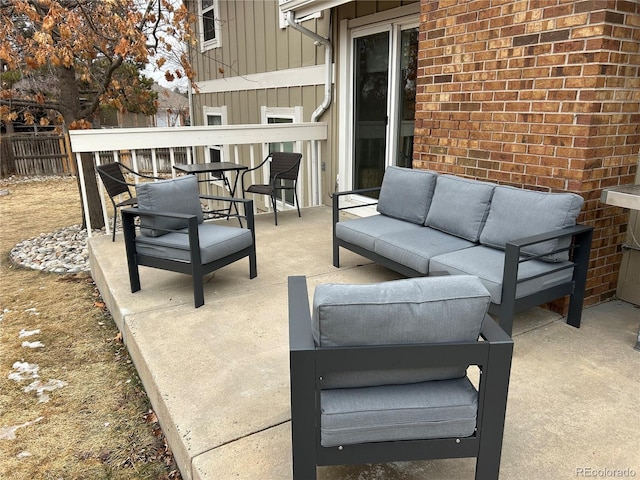 view of patio / terrace featuring outdoor lounge area and fence