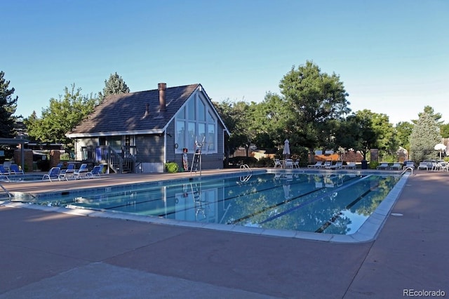 community pool featuring a patio area