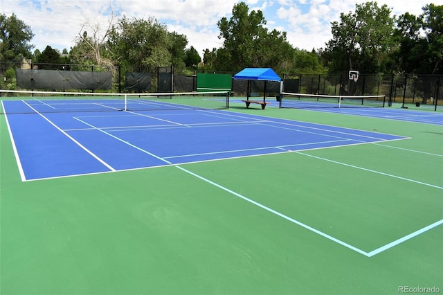 view of sport court featuring community basketball court and fence