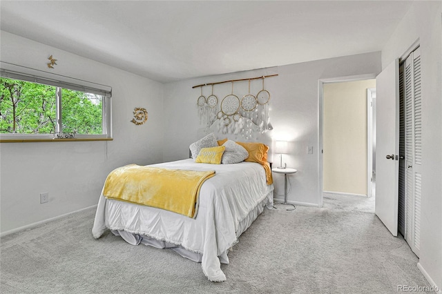 12355 E Arkansas Pl, Aurora, CO 80012 - carpeted bedroom with baseboards and a closet