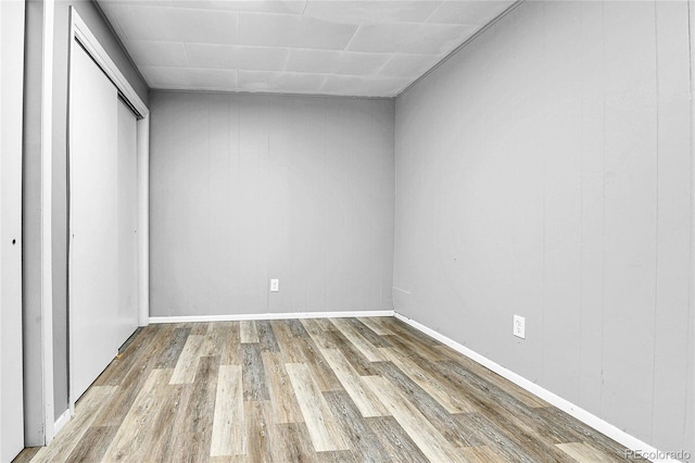 12355 E Arkansas Pl, Aurora, CO 80012 - unfurnished bedroom with wood finished floors, a closet, and baseboards