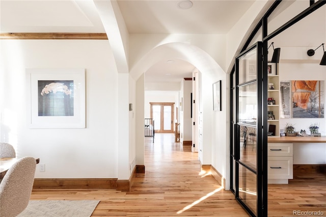 hall with light wood-type flooring