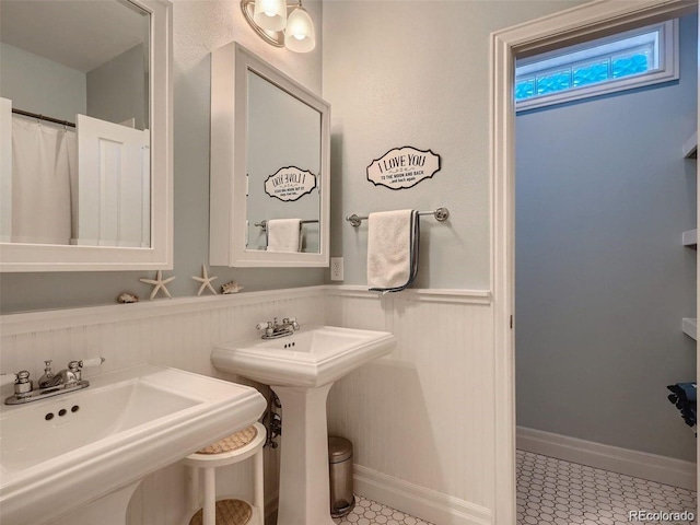 930 Kearney St, Denver, CO 80220 - bathroom with a sink and wainscoting