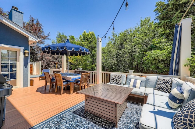 930 Kearney St, Denver, CO 80220 - wooden deck with outdoor dining area, an outdoor hangout area, and a grill