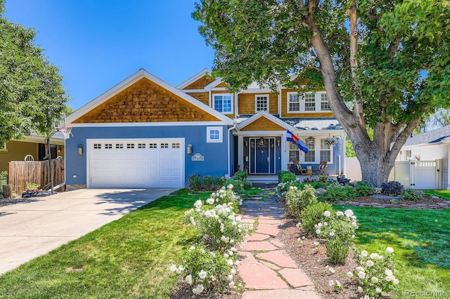 930 Kearney St, Denver, CO 80220 - view of front facade featuring an attached garage, driveway, and stucco siding