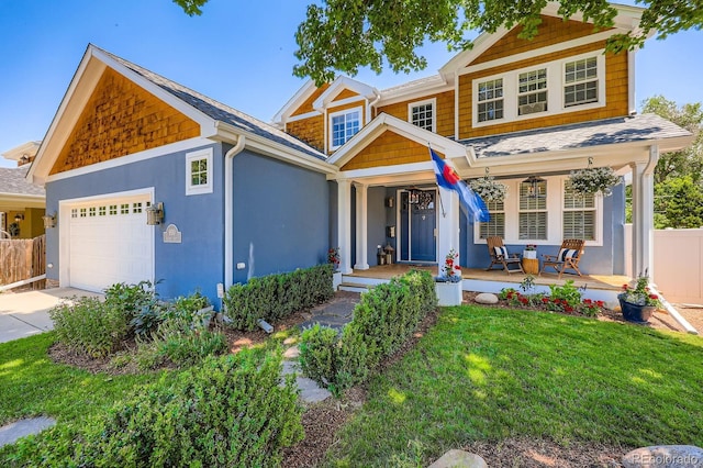 930 Kearney St, Denver, CO 80220 - craftsman house featuring an attached garage, a porch, stucco siding, driveway, and a shingled roof