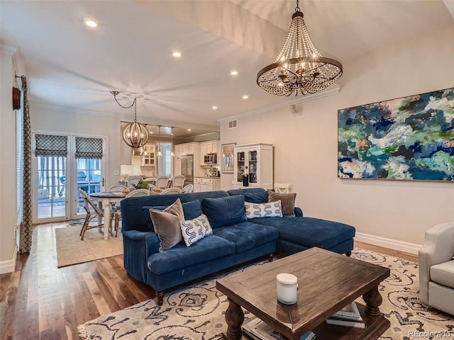 930 Kearney St, Denver, CO 80220 - living area featuring a chandelier, wood finished floors, ornamental molding, and recessed lighting
