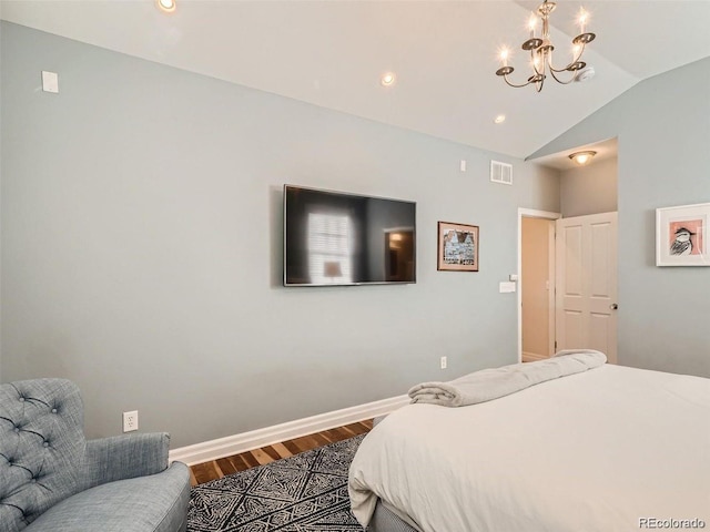 930 Kearney St, Denver, CO 80220 - bedroom featuring a chandelier, wood finished floors, and vaulted ceiling