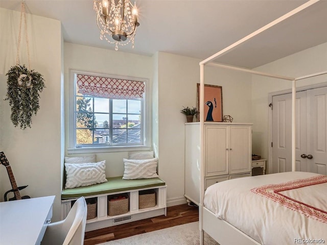 930 Kearney St, Denver, CO 80220 - bedroom featuring wood finished floors, a chandelier, and a closet