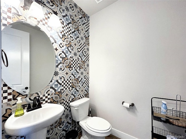 bathroom featuring sink and toilet