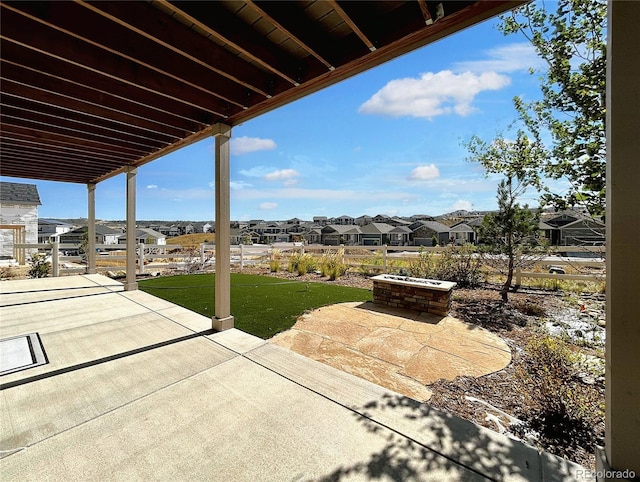 view of patio with an outdoor fire pit