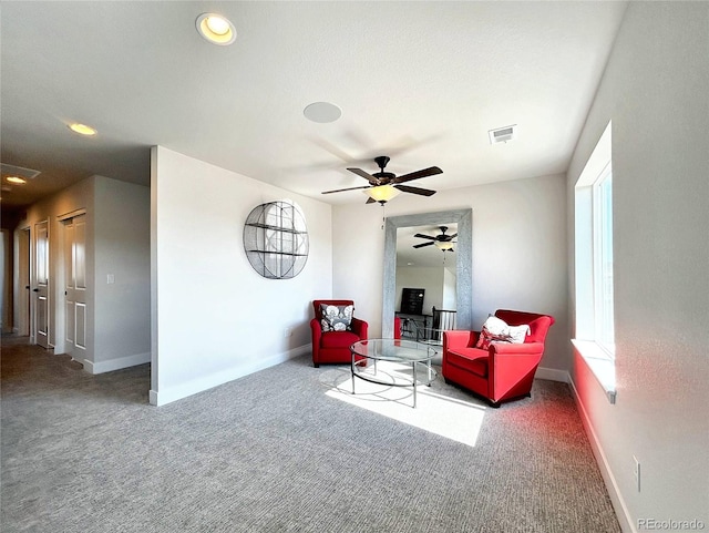 sitting room featuring carpet flooring