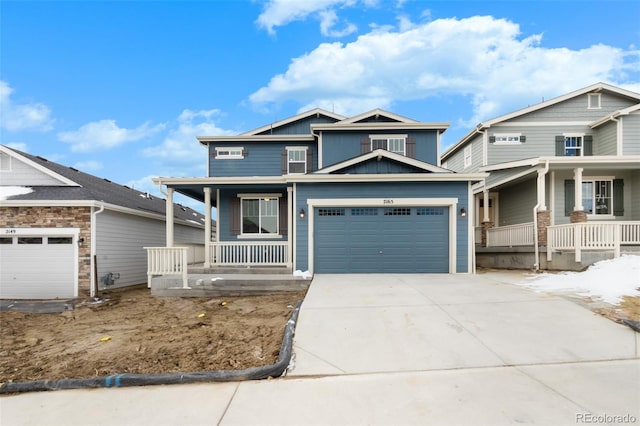 craftsman-style home featuring covered porch, driveway, board and batten siding, and a garage