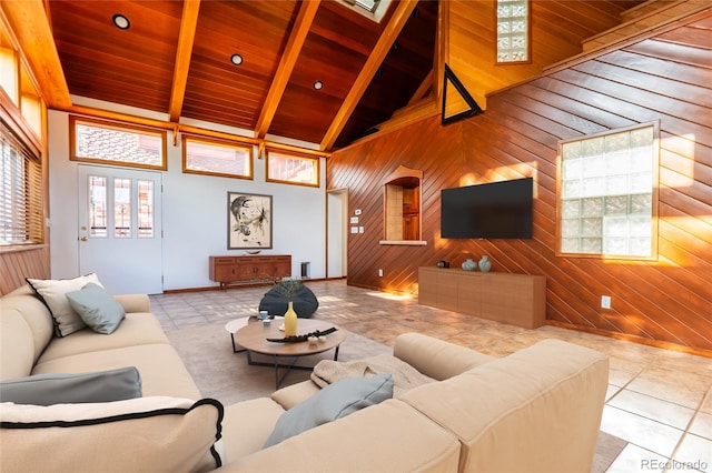 tiled living room featuring beam ceiling, wood ceiling, high vaulted ceiling, and wood walls