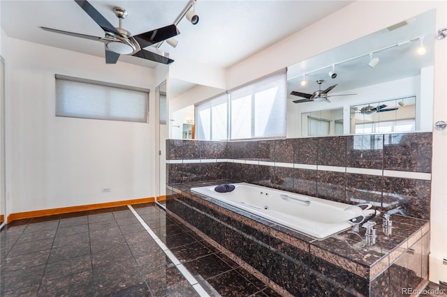 bathroom featuring ceiling fan, tile walls, and tiled tub