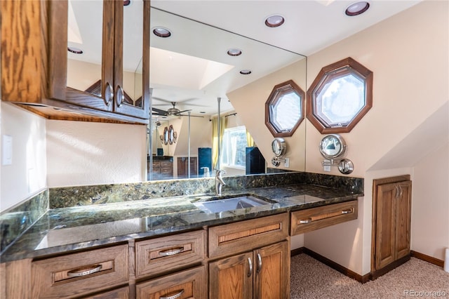 bathroom featuring vanity and ceiling fan