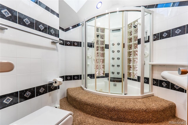 bathroom featuring enclosed tub / shower combo, vaulted ceiling, and tile walls