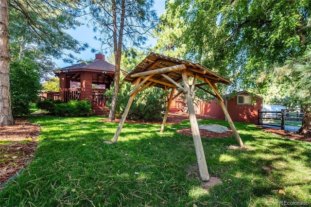 view of yard featuring a gazebo and a storage shed