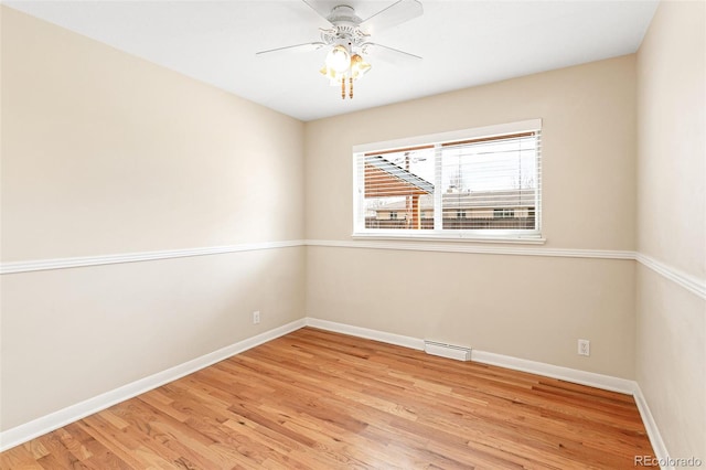 unfurnished room with light wood-type flooring and ceiling fan