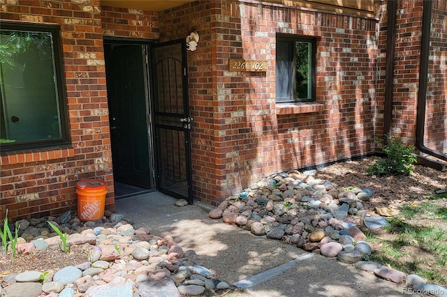 2261 S Buckley Rd Unit 102, Aurora, CO 80013 - doorway to property featuring brick siding
