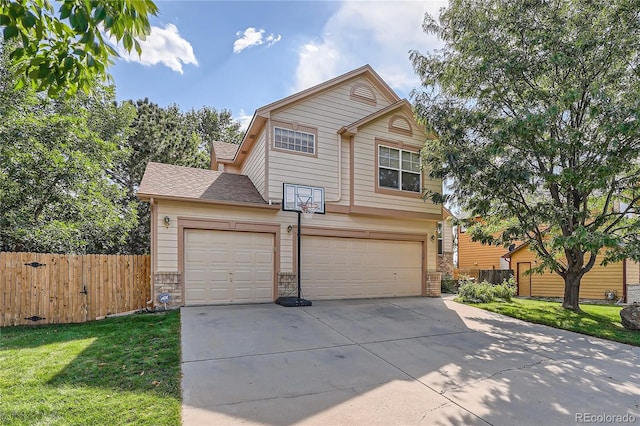 front facade with a front yard and a garage