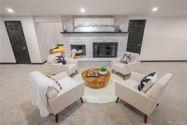 living room featuring light carpet and a brick fireplace