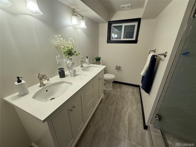 bathroom featuring vanity, toilet, and an enclosed shower