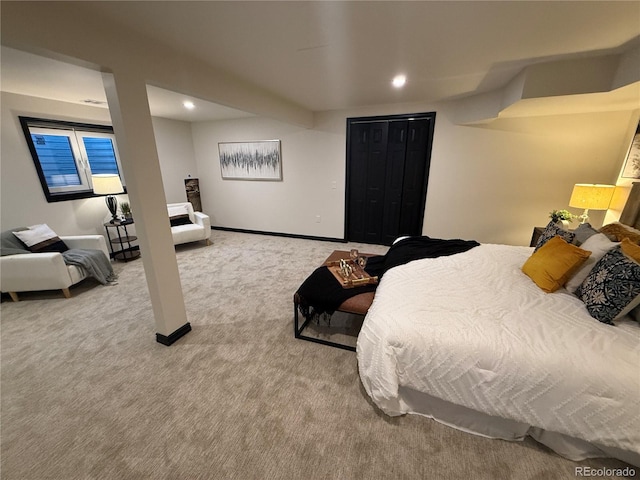 bedroom featuring a closet and light carpet