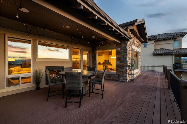 wooden deck featuring outdoor dining area
