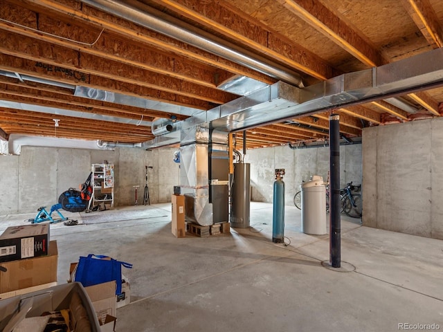 unfinished below grade area with gas water heater and heating unit
