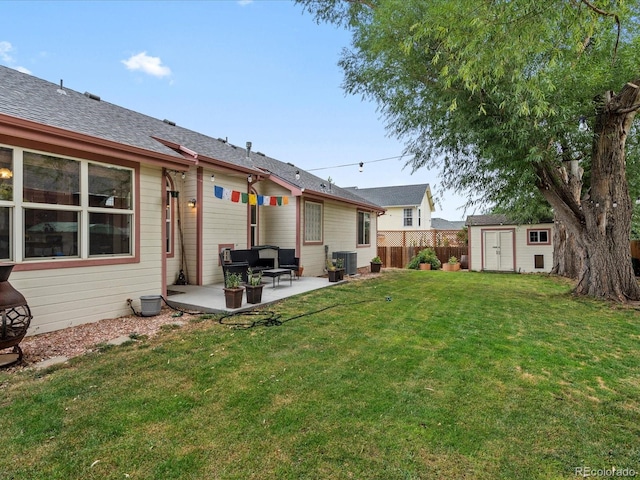 rear view of house with a patio area, a shed, central air condition unit, an outdoor structure, and fence