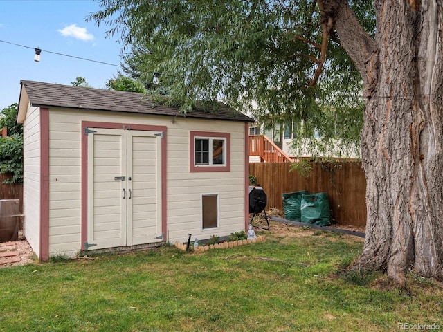 view of shed with fence