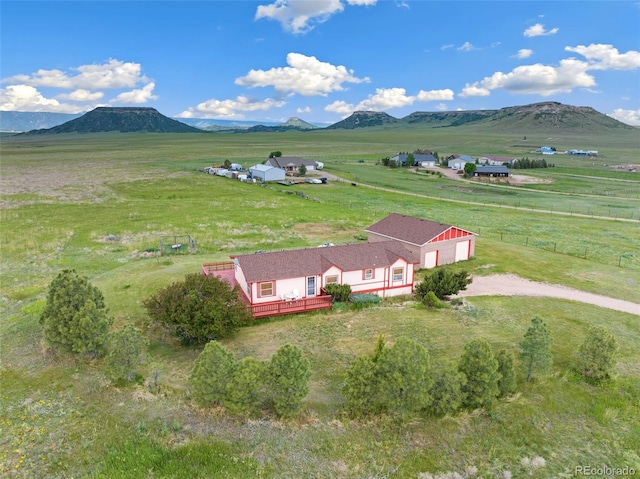 birds eye view of property with a mountain view and a rural view