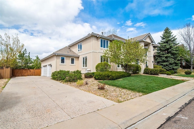 view of front of property with stucco siding, driveway, and an attached garage