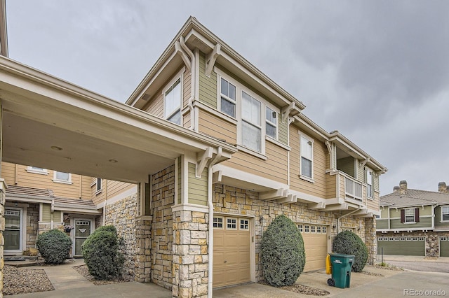 12835 Mayfair Way Unit C, Englewood, CO 80112 - view of side of property with stone siding and a garage