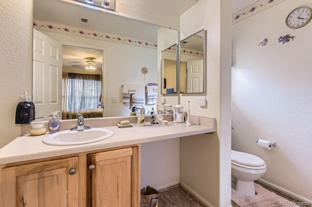 12835 Mayfair Way Unit C, Englewood, CO 80112 - ensuite bathroom featuring vanity, a ceiling fan, and tile patterned flooring