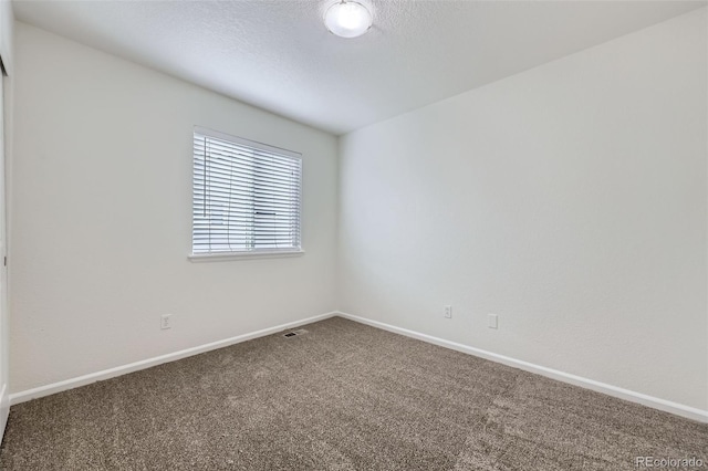 20000 E Mitchell Pl Unit 35, Denver, CO 80249 - unfurnished room with carpet floors, baseboards, and a textured ceiling