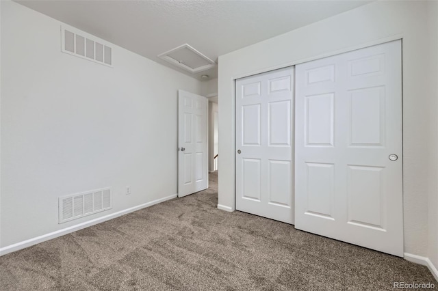 20000 E Mitchell Pl Unit 35, Denver, CO 80249 - unfurnished bedroom featuring carpet floors, baseboards, and a closet
